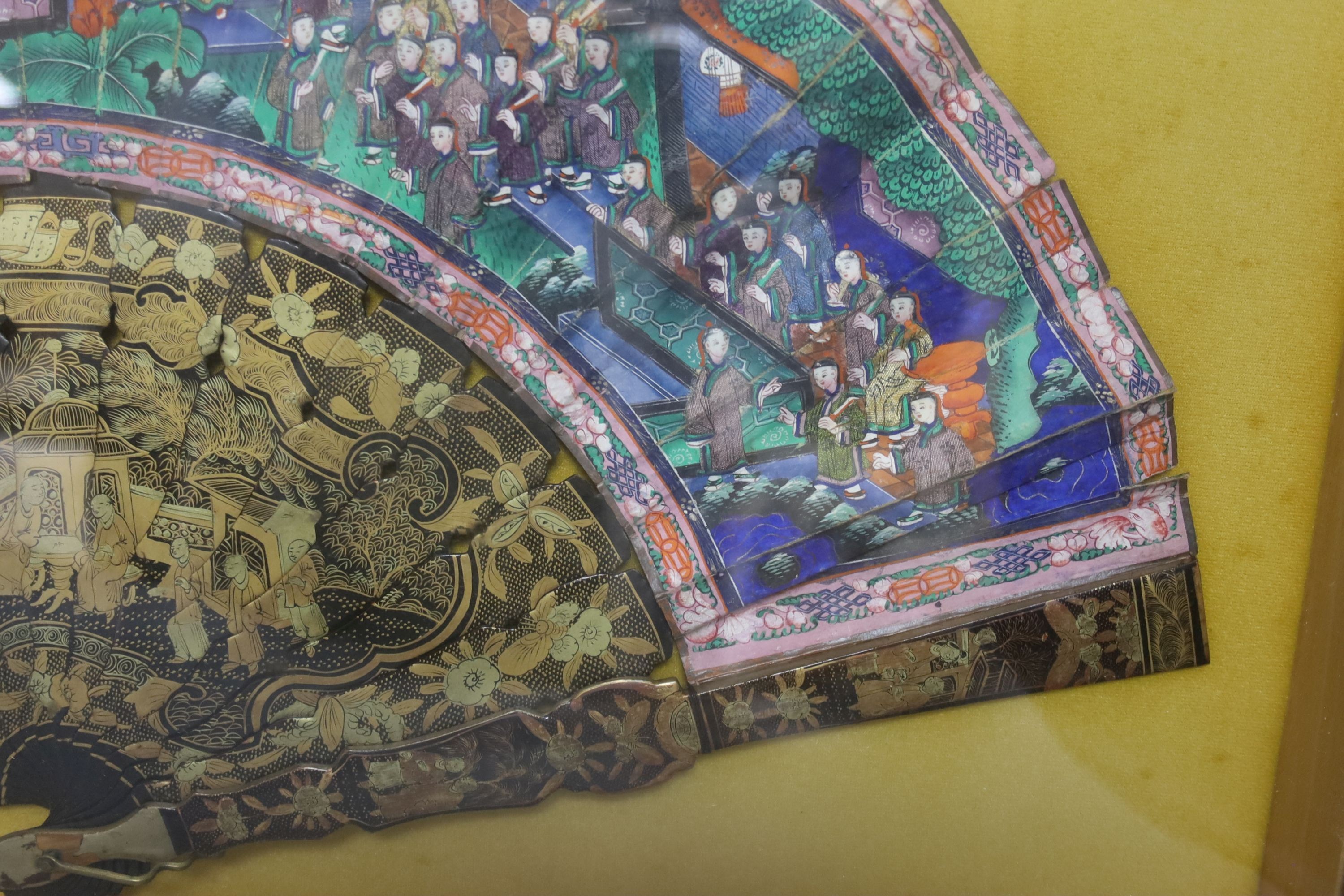A cased 19th century Chinese Canton export gilt decorated lacquer fan, with painted paper leaf, case 35 x 59 cm
